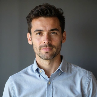 A confident man with thoughtful expression, representing a product development expert.
